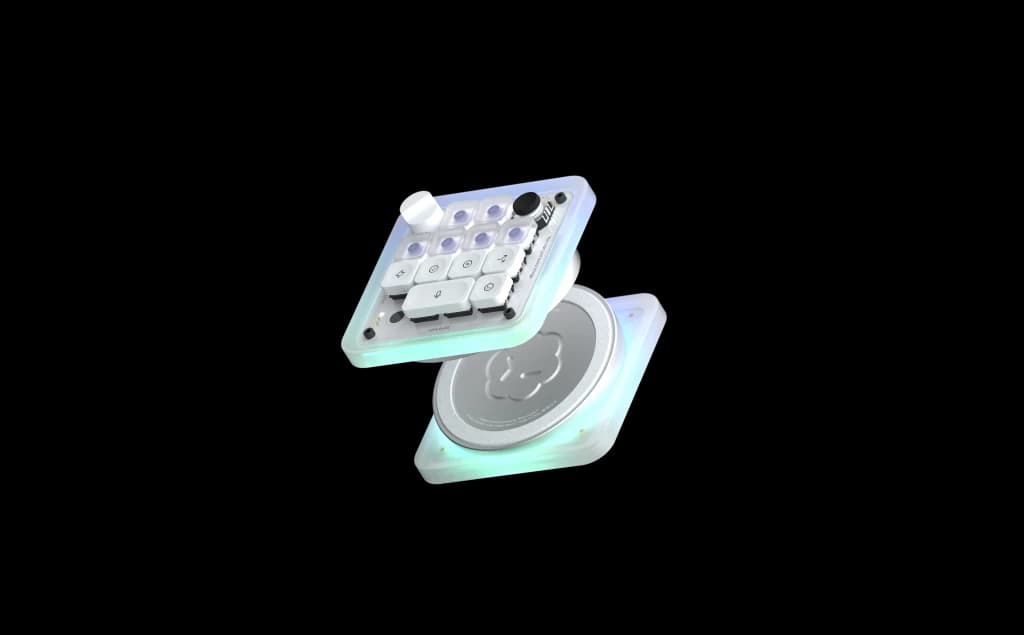 Exploded view of the Codex Micro — the key deck floating above its weighted base, RGB glow between the layers